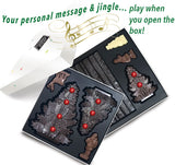 7 solid gourmet chocolate winter characters (milk/dark/white) with a dark chocolate base about the size of a chocolate bar. The trees are decorated with puffed cereal coated with colored white chocolate. When the box is opened, your personally recorded message and instrumental of 'We wish you a Merry Christmas' play!