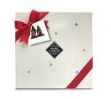 7 solid gourmet chocolate winter characters (milk/dark/white) with a dark chocolate base about the size of a chocolate bar. The trees are decorated with puffed cereal coated with colored white chocolate. When the box is opened, your personally recorded message and instrumental of 'We wish you a Merry Christmas' play!